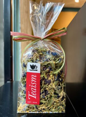 Clear bag of herbal blend made by Teaism including Butterfly Pea Flowers, Calendula Petals, and Lemon Verbena.